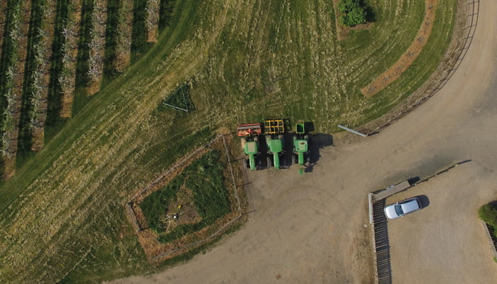 An arial shot of mudwalls farm and tractors from above
